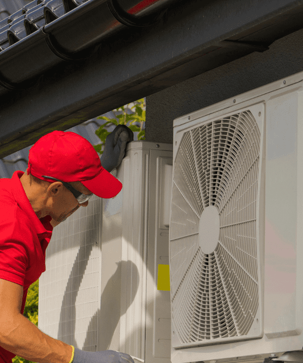 HVAC Installer inspecting a cooling unit.